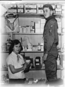 Two children behind the parts counter in the early Munch's store
